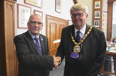 Outgoing Fenland District Council Chairman Cllr Alex Miscandlon, left, with incoming Chair Cllr Nick Meekins 2023