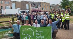 Penny Stocks, front second from left, celebrates Green Flag Award with volunteer & FDC colleagues